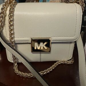 Michaels kors brand, ivory color, chain strap.